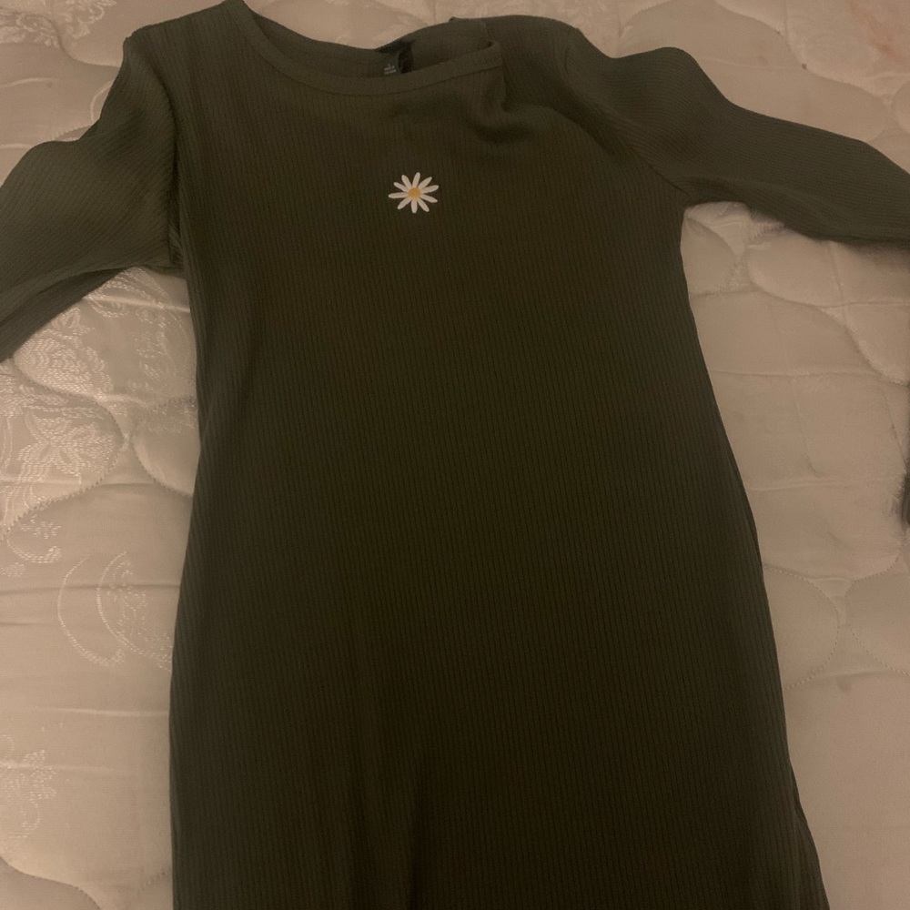 Large dark green dress with a sunflower on it